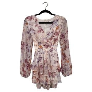 Pink floral romper from Francesca’s. Miami brand. 
Small.